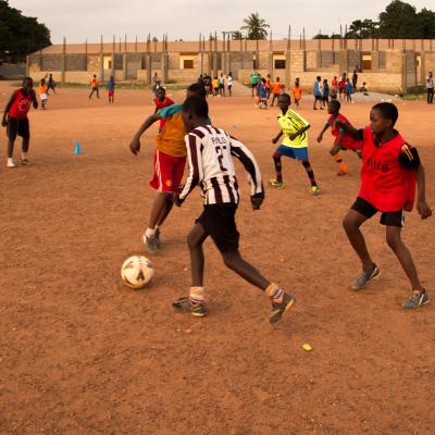 A Projects Abroad volunteer work with teens to teach football in Ghana. A sports player gains experience through volunteer football coaching in Ghana.
